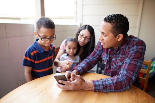 family looking at phone