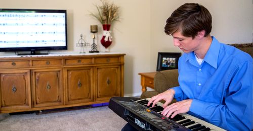 Young man playing keyboard