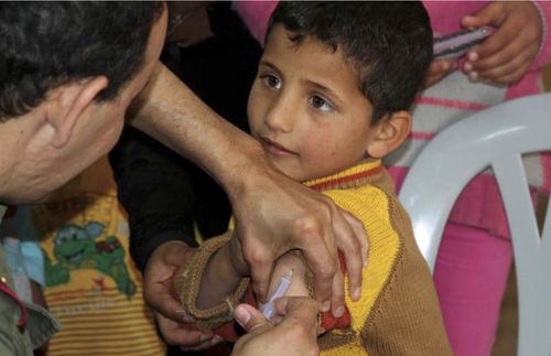 child being immunized