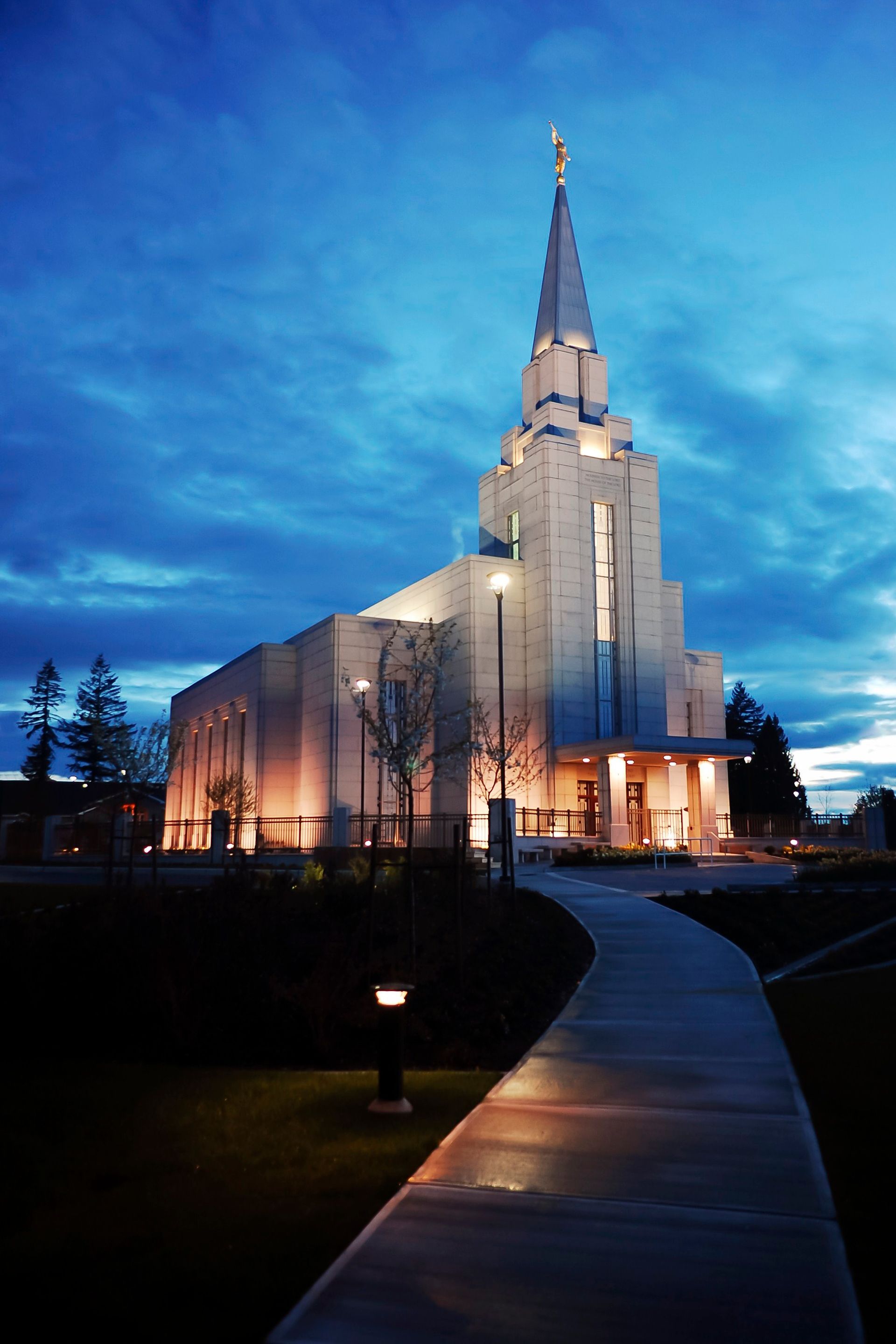 The Vancouver British Columbia Temple in the evening, with the entrance and grounds.