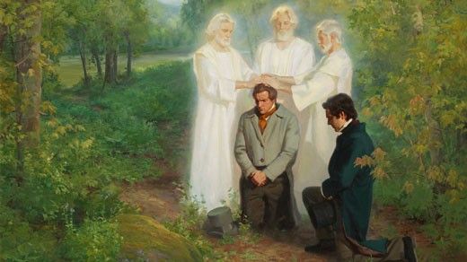 John the Baptist laying his hands on a kneeling Joseph Smith conferring the Aaronic Priesthood on him.  Oliver Cowdery is kneeling with him. They are in a grove of trees.