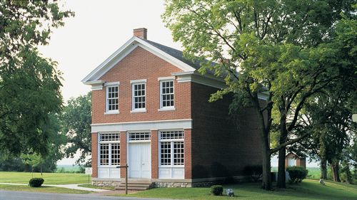Red brick building with white trim.