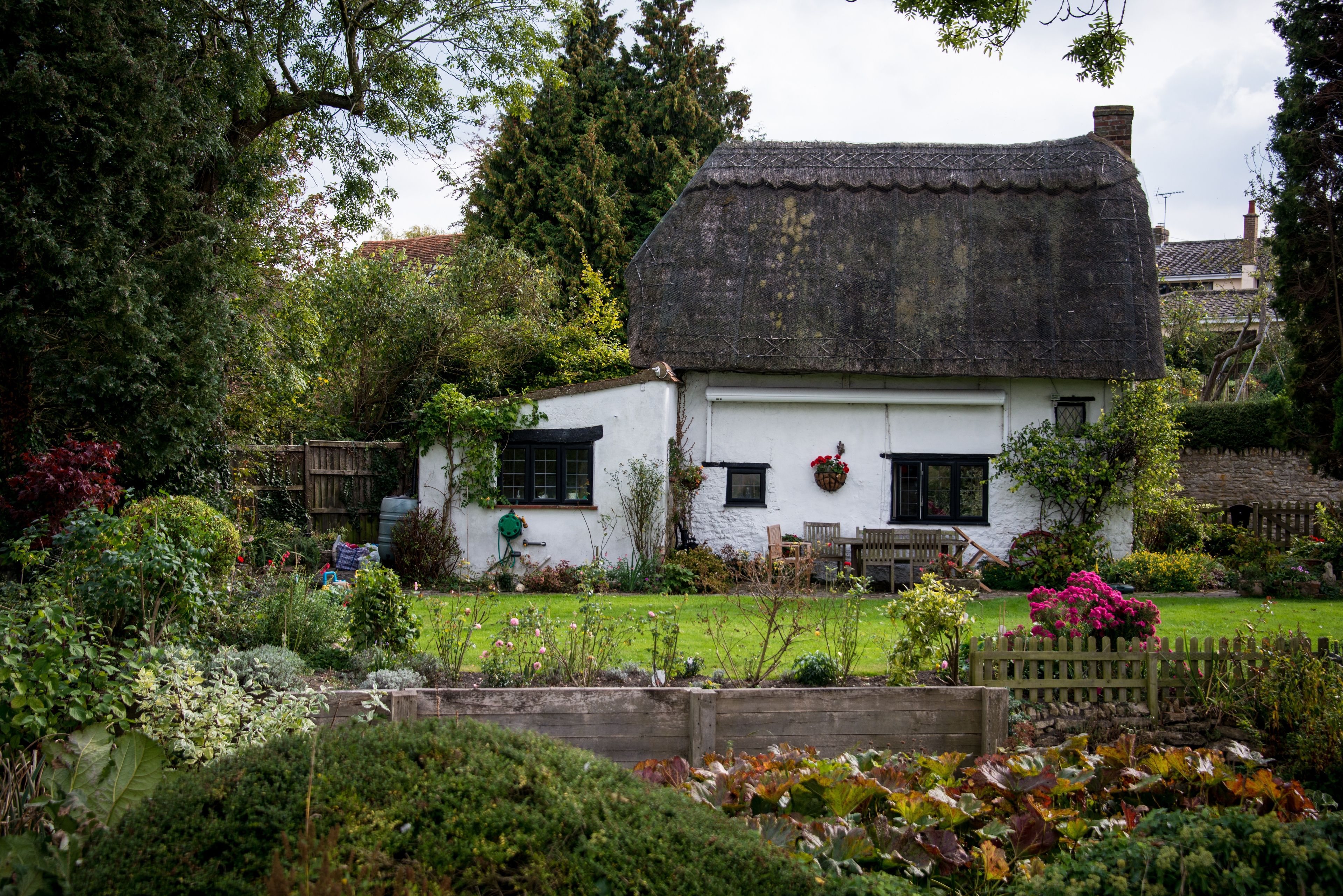 A white and black cottage in the United Kingdom.