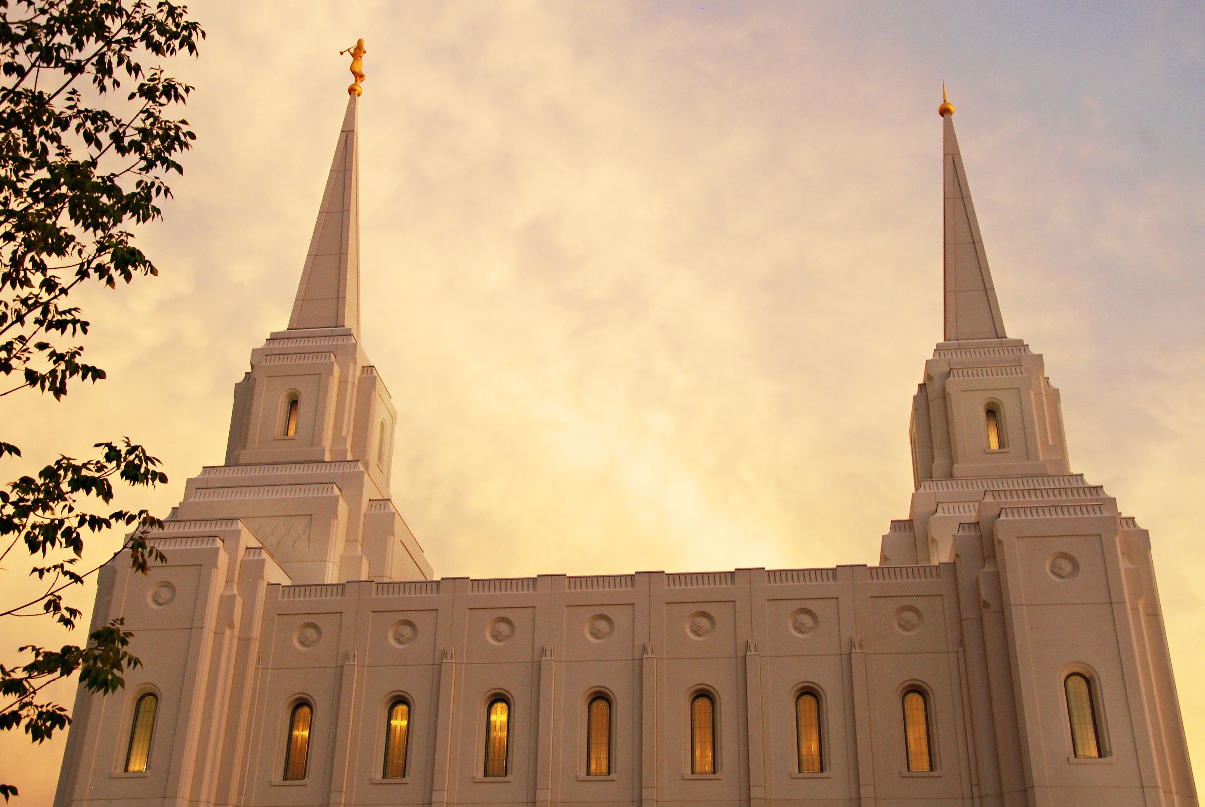 The Brigham City Utah Temple at dawn, including spires and windows.