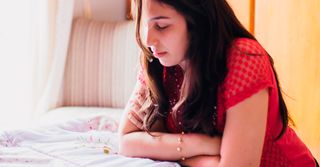 Young woman praying