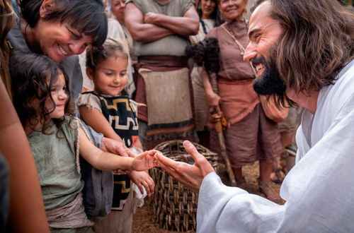 picture of children with actor playing Jesus