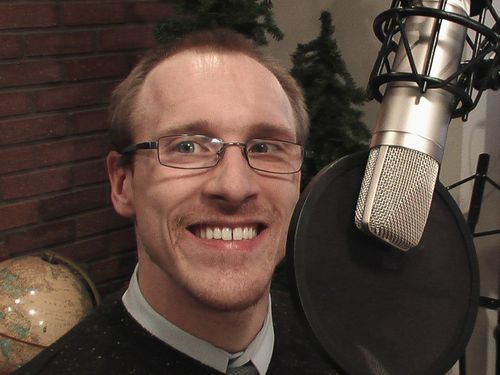 James Johnson beside a radio microphone.