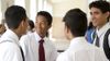 young men talking in foyer