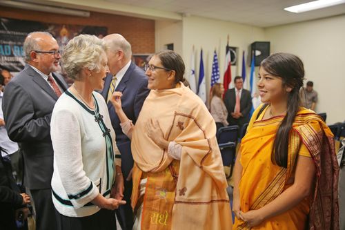 Elder and Sister Renlund greeting people