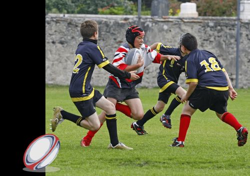 Men playing rugby