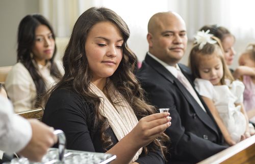 girl taking sacrament