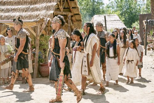 A procession of Lamanites follows King Lamoni and the queen in the land of Ishmael.