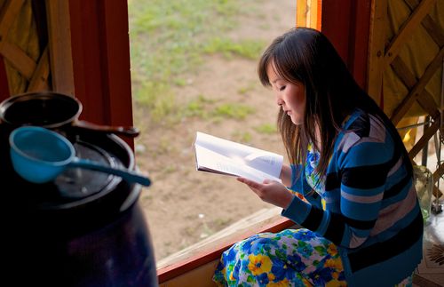 woman reading magazine