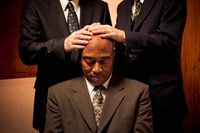 a black man being ordained