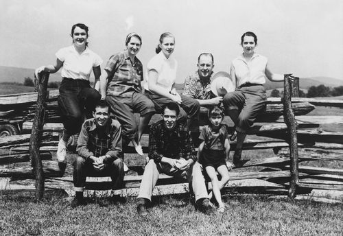 Benson and family on fence