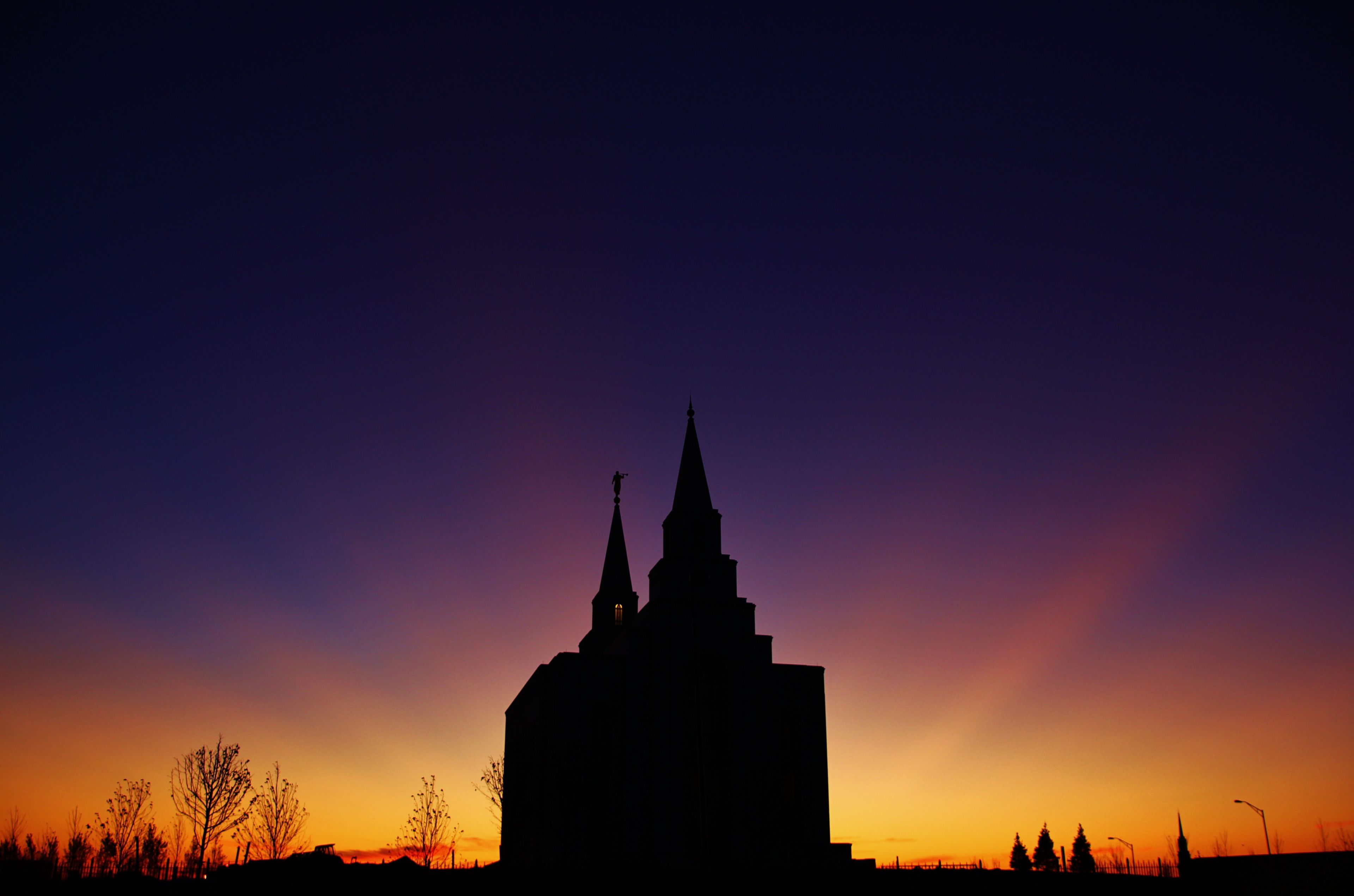 The Kansas City Missouri Temple at sunset, including scenery.