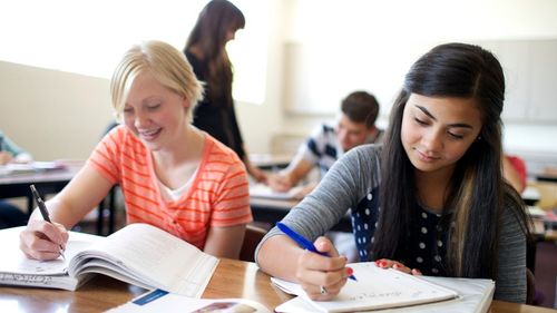 youth working on school assignments