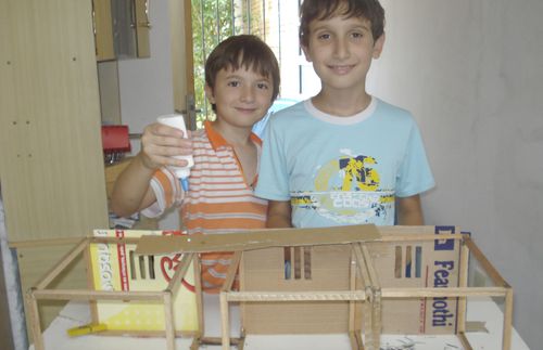 brothers with model of the temple