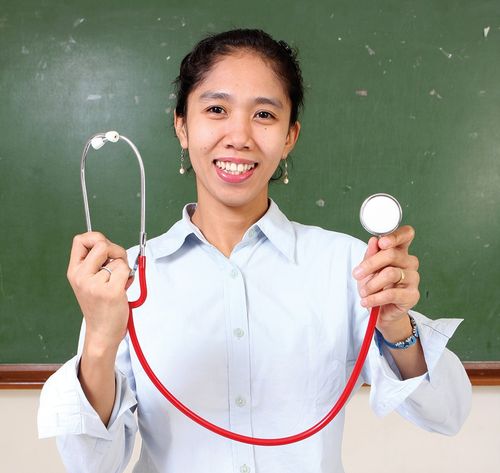 woman holding a stethoscope