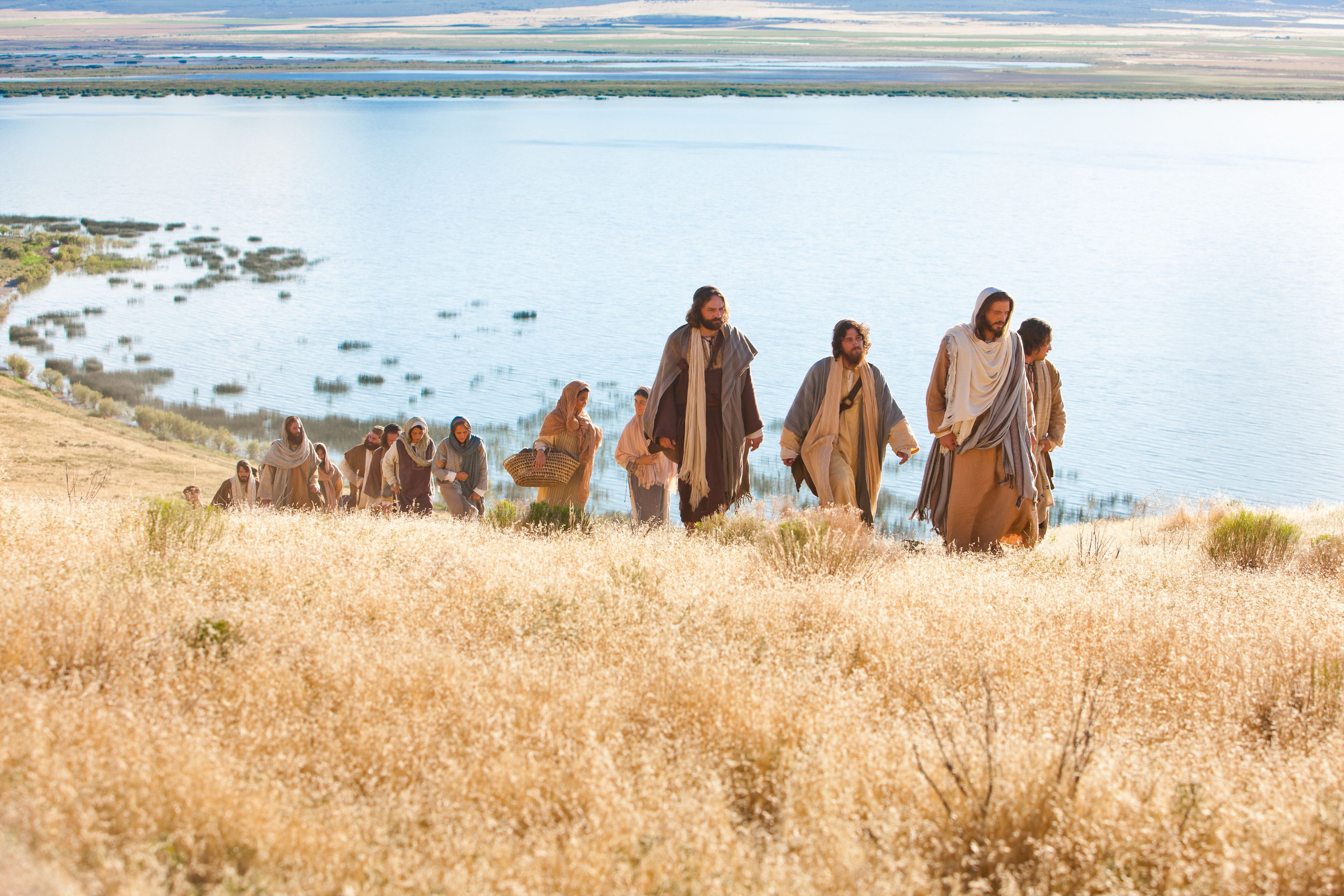 Men and women gather to come listen to Jesus as He gives His Sermon on the Mount.