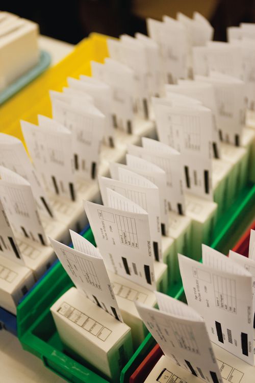 Containers of microfiche out on a table at the Granite Mountain Records Vault.