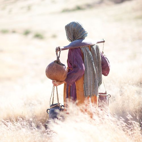 a Samaritan woman carrying a yoke