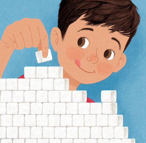boy stacking sugar cubes to make a temple model