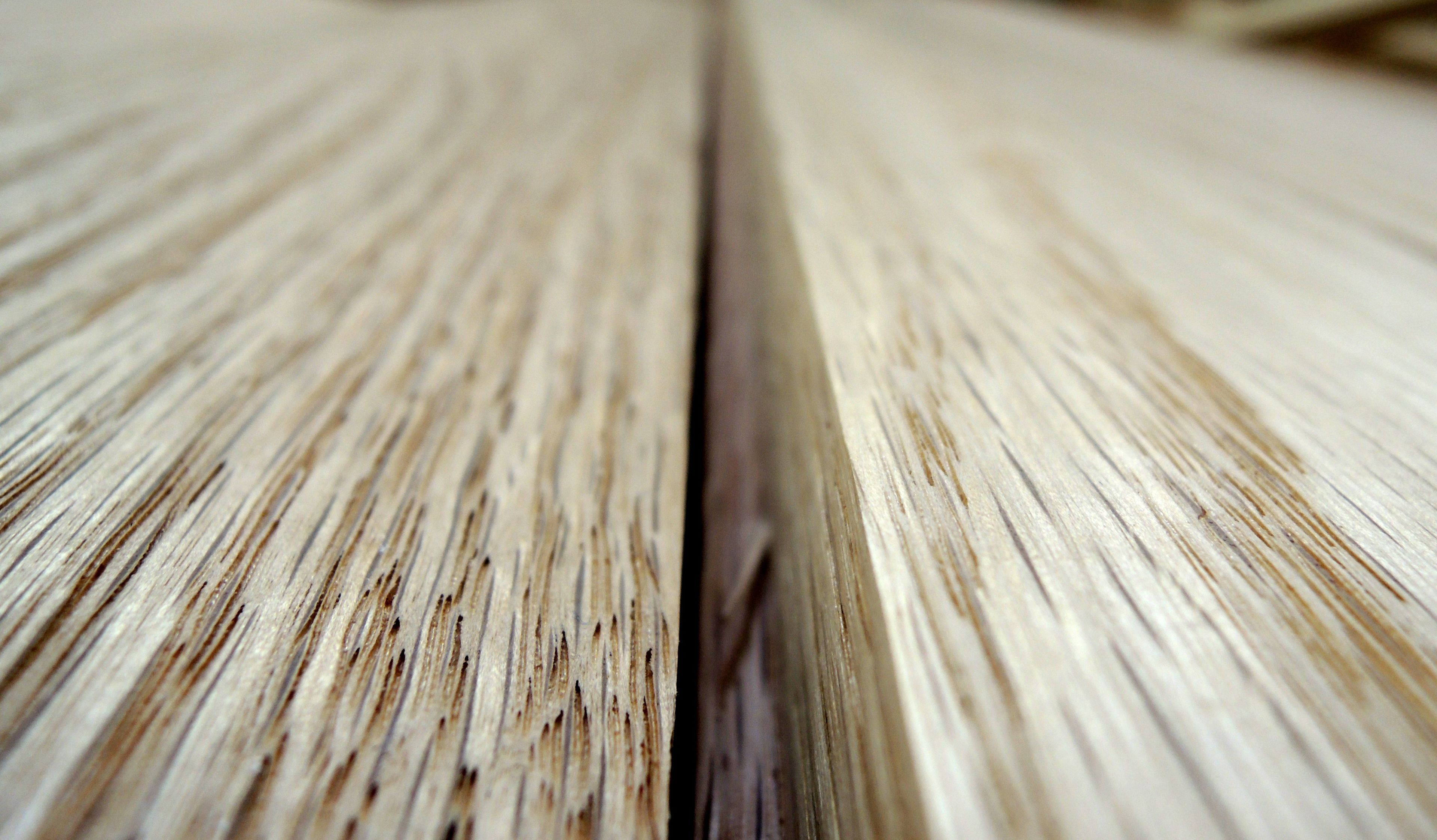 Two wooden boards up close to one another.