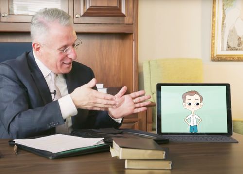 Elder Soares showing a cartoon video