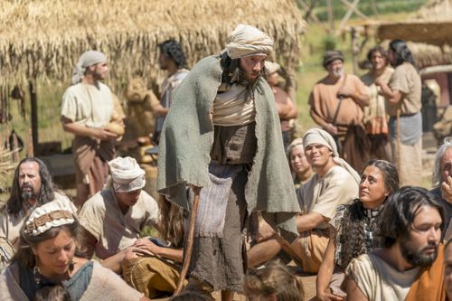A crippled man joins the other Nephites who are gathered outside the temple.