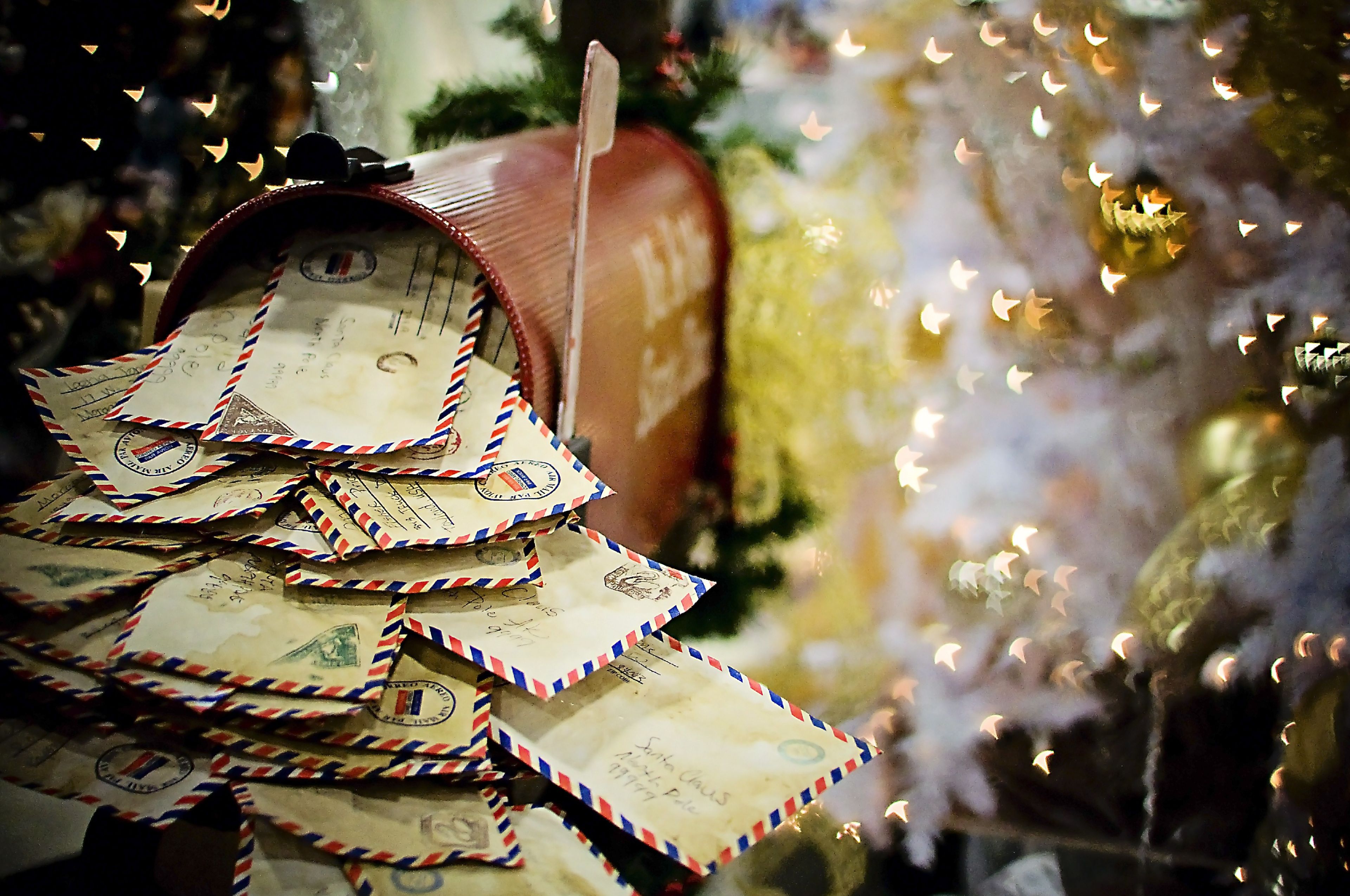 An image of letters in a mailbox during Christmastime.