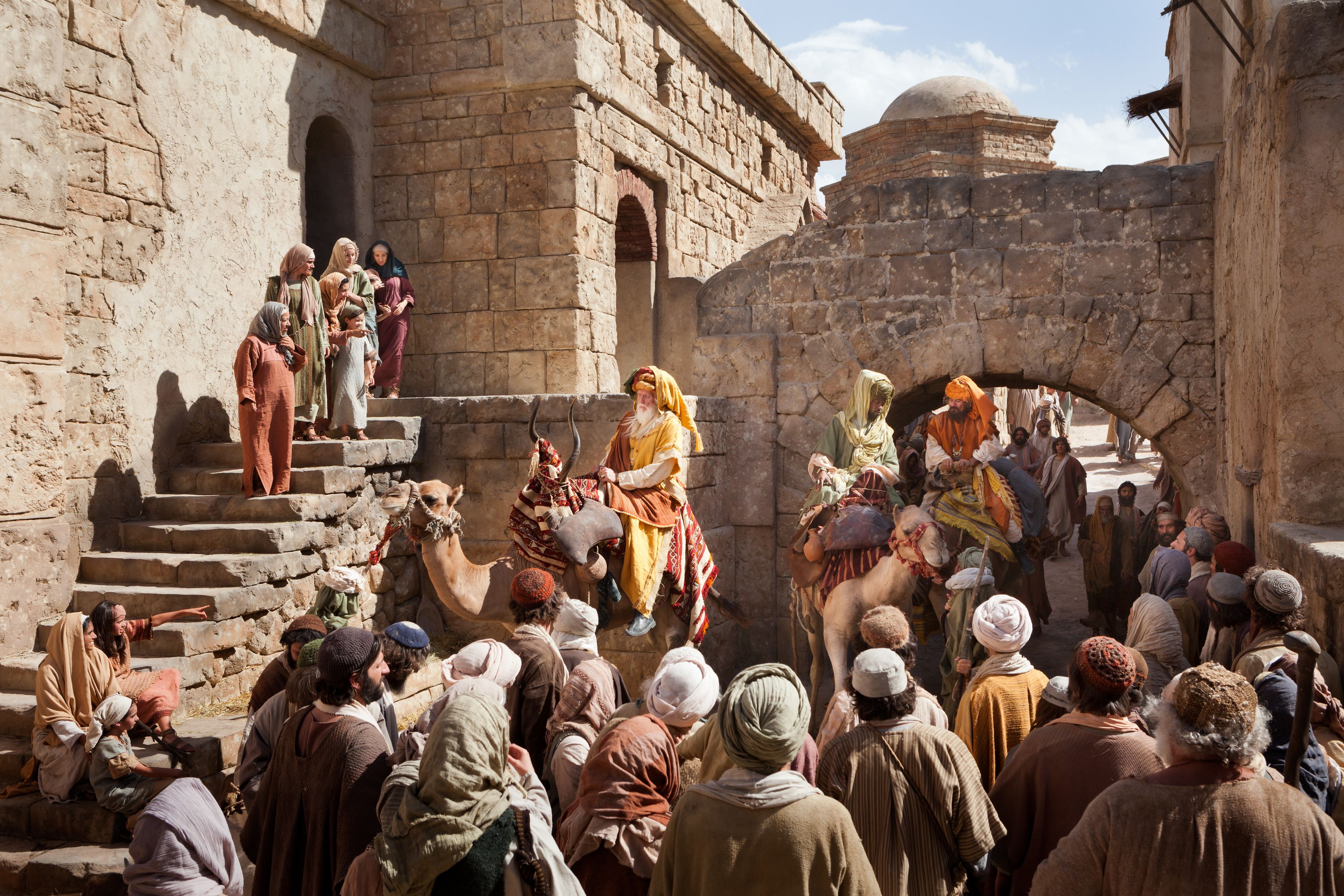 The Wise Men make their way through a crowd of people to give their gifts to the Christ child.