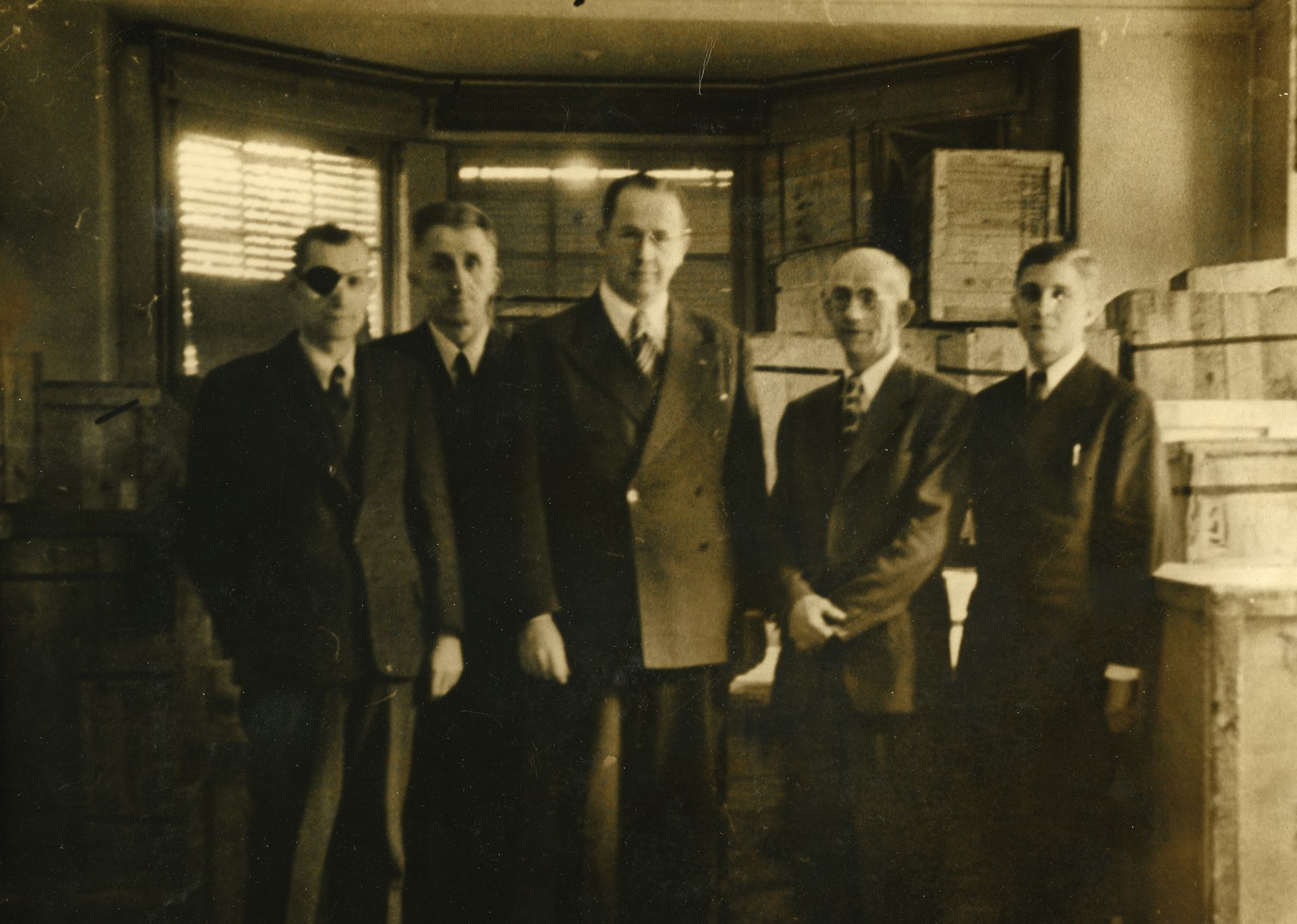 President Ezra Taft Benson standing with other men during a visit to the European Mission in 1946.