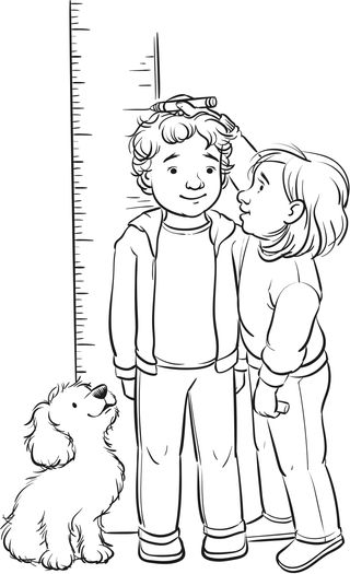 boy standing by measuring stick