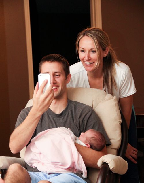 father holding baby