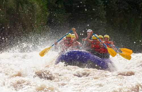 people rafting through rapids