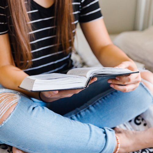 girl reading Book of Mormon