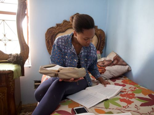 young woman studying the scriptures