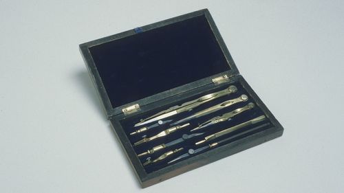 photograph of a case holding various writing pens