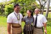 friends in Tonga stand together arm in arm