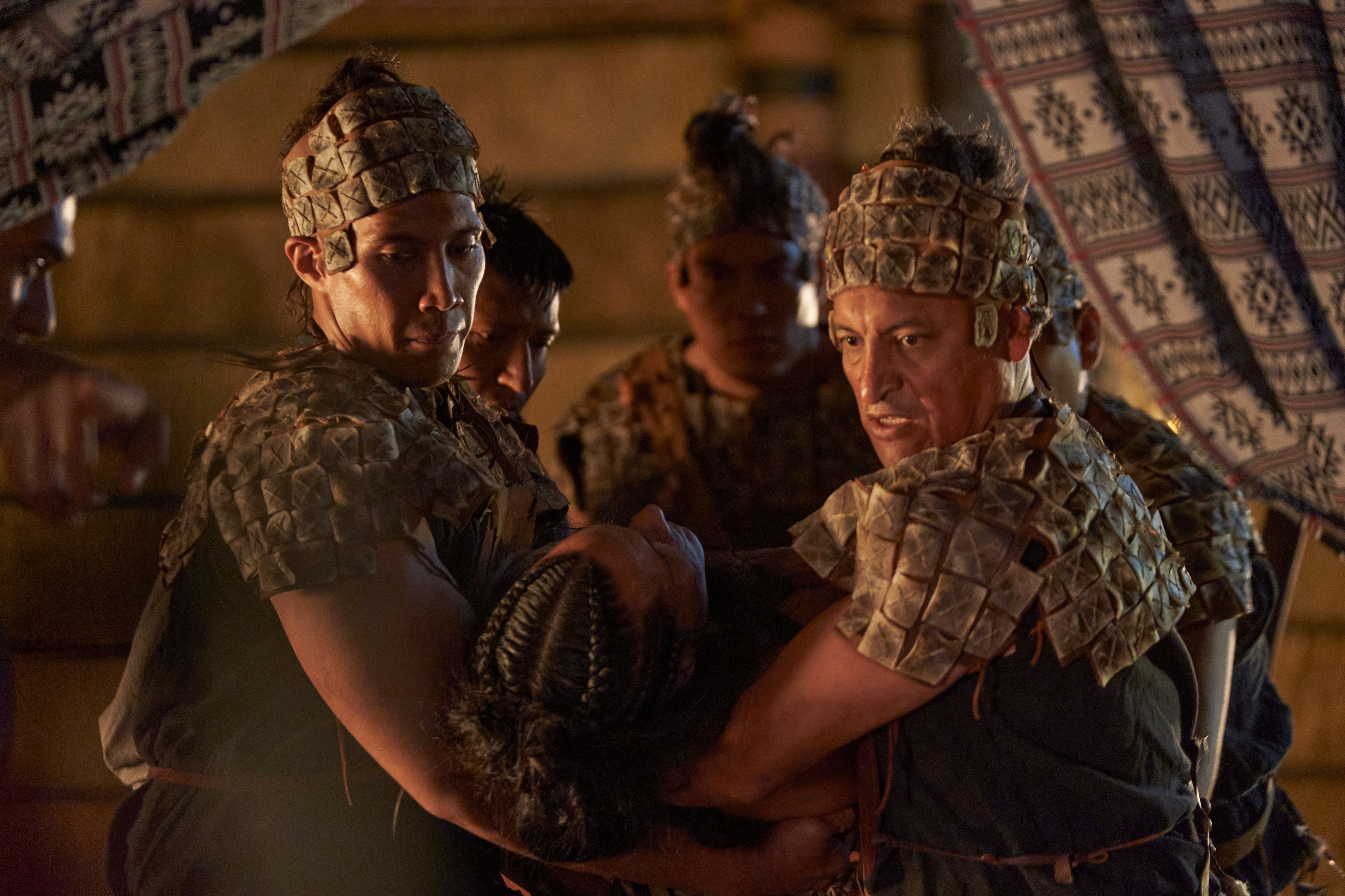 The servants of King Lamoni carry his body after he has fallen to the earth in the land of Ishmael.