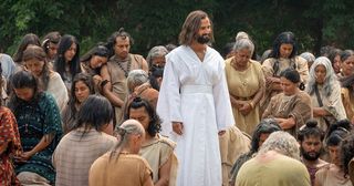 discípulos orando ao redor de Cristo