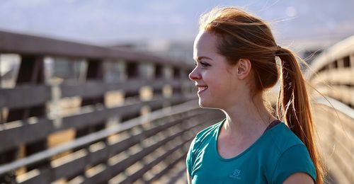 young woman on bridge