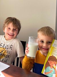 two boys holding Brazilian limeade