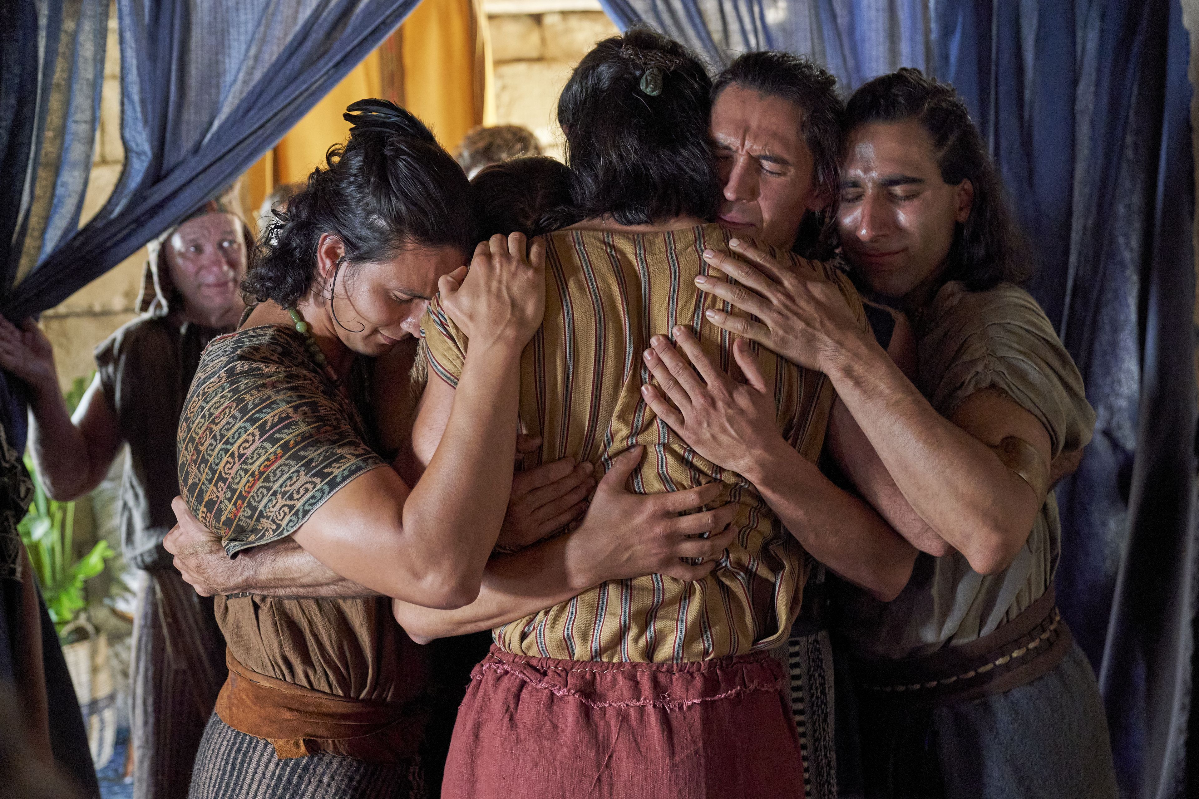 The sons of Mosiah (Aaron, Ammon, Omner, and Himni) embrace Alma the Younger after he wakes.
