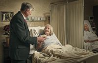 man visiting woman in hospital