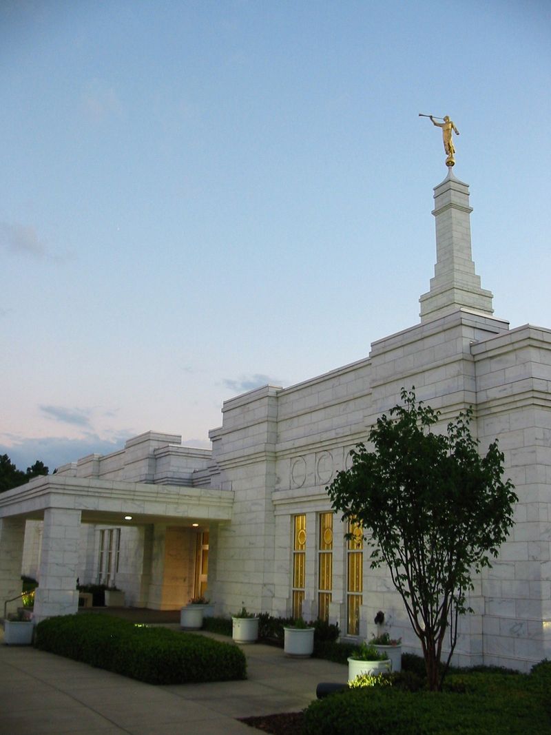 The entrance to the Birmingham Alabama Temple is lit up in the evening.