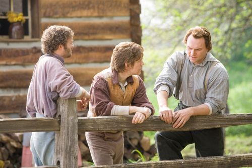 portrayal of the Prophet Joseph Smith standing with two men