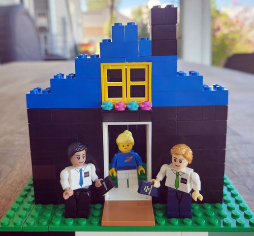 A lego creation of missionaries at a woman's house, created by a child named Will Powell.