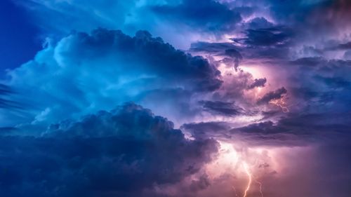 Dark storm clouds with a lightning bolt